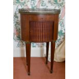 A FRENCH OVAL BEDSIDE TABLE with marble top, tambour front, on tapering legs. 2ft 1ins wide.
