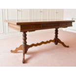A LONG OAK TABLE with three drawers, turned supports and tripod legs. 5ft 7ins long x 2ft 2ins