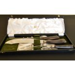 A CASED HARROD'S THREE PIECE CARVING SET.