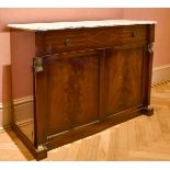 A MAHOGANY MARBLE TOP CUPBOARD, after Thomas Hope, with one long drawer over double panel doors with
