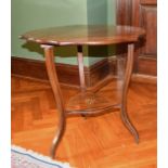A VICTORIAN ROSEWOOD INLAID FOLDING FLAP CLOVERLEAF TABLE with curving legs, under-tier and castors.
