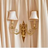 A PAIR OF TWO BRANCH BRASS WALL LIGHTS.