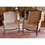 A GOOD PAIR OF MAHOGANY WING ARMCHAIRS with show wood frame, loose padded seats, on cabriole legs.