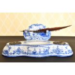 A BLUE AND WHITE POTTERY INKSTAND of DUTCH STYLE AND QUILL.