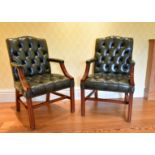 A GOOD PAIR OF MAHOGANY BUTTONED BACK ARMCHAIRS with curving arms and square chamfered legs.