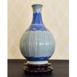 A CHINESE CELADON AND BLUE BULBOUS VASE. 12ins high.