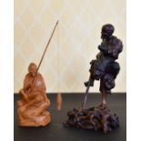 A CHINESE CARVED WOOD ONI on a stand, and A CHINESE FISHERMAN (2).