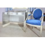 A SILVERED PAINTED DRESSING TABLE AND CHAIR.