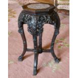 A CHINESE CARVED HARDWOOD PLANT STAND with octagonal top and hardstone. 2ft high.