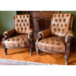 A GOOD PAIR OF VICTORIAN MAHOGANY GREEN STUDDED LEATHER ARMCHAIRS, with iron studs, on carved legs