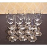 A SET OF ELEVEN LARGE PLAIN WINE GLASSES.