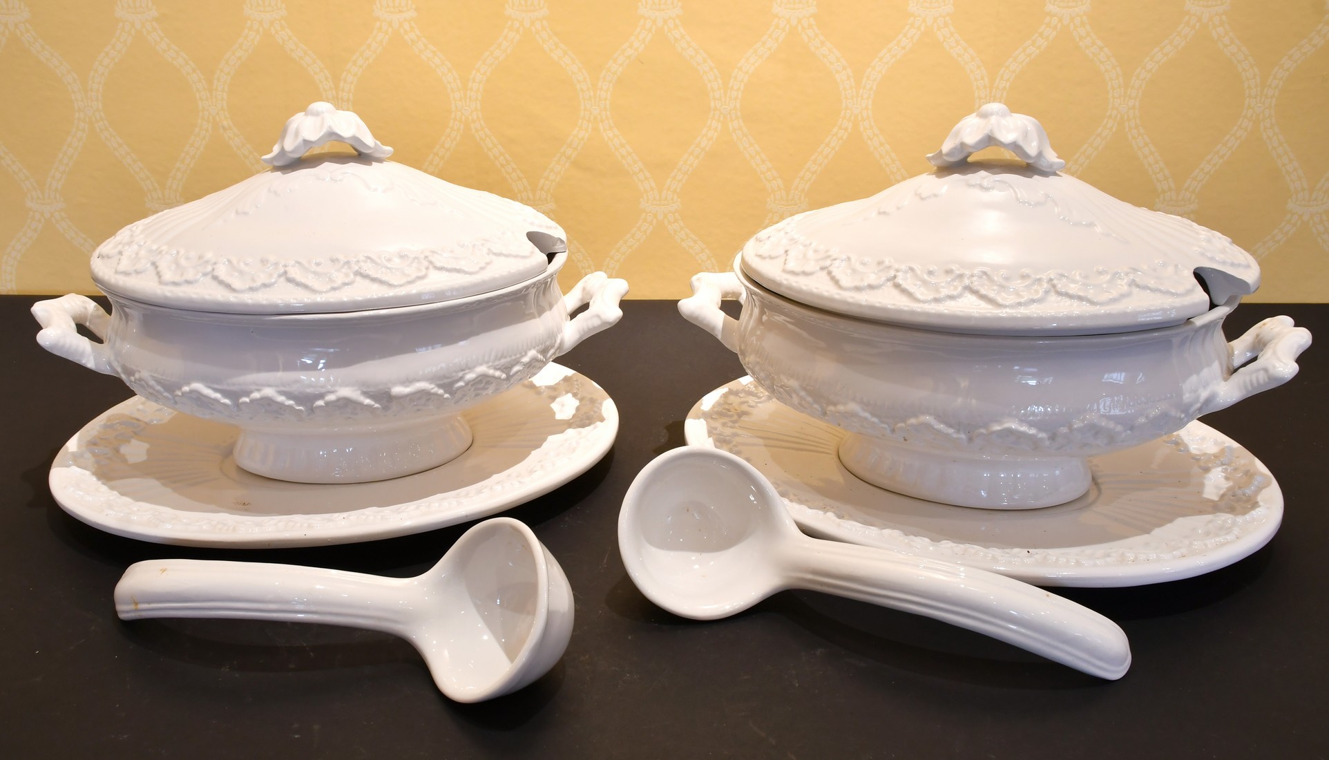 A LARGE PAIR OF ITALIAN WHITE POTTERY TUREENS, COVERS AND STANDS.