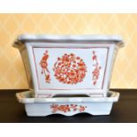 A CHINESE PORCELAIN RECTANGULAR JARDINIERE AND STAND. 1ft 2ins wide.