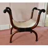 A MAHOGANY CROSS FRAME STOOL.