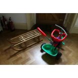A CHILD'S SLEDGE AND TRACTOR (2).