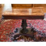 A GOOD LATE REGENCY ROSEWOOD TEA TABLE with folding top, centre column, platform base with four claw