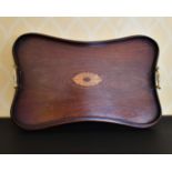 AN EDWARDIAN MAHOGANY INLAID TWO-HANDLED TEA TRAY.