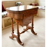 A GOOD VICTORIAN WALNUT GAMES AND SEWING STAND, the folding top opening to reveal backgammon,