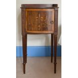 A MAHOGANY INLAID BOWFRONTED BEDSIDE TABLE on turned legs, 1ft 4ins wide, and a lamp.