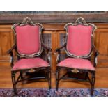 A GOOD PAIR OF ITALIAN GILDED ARMCHAIRS with padded backs, drop-in seats, on tapering legs.