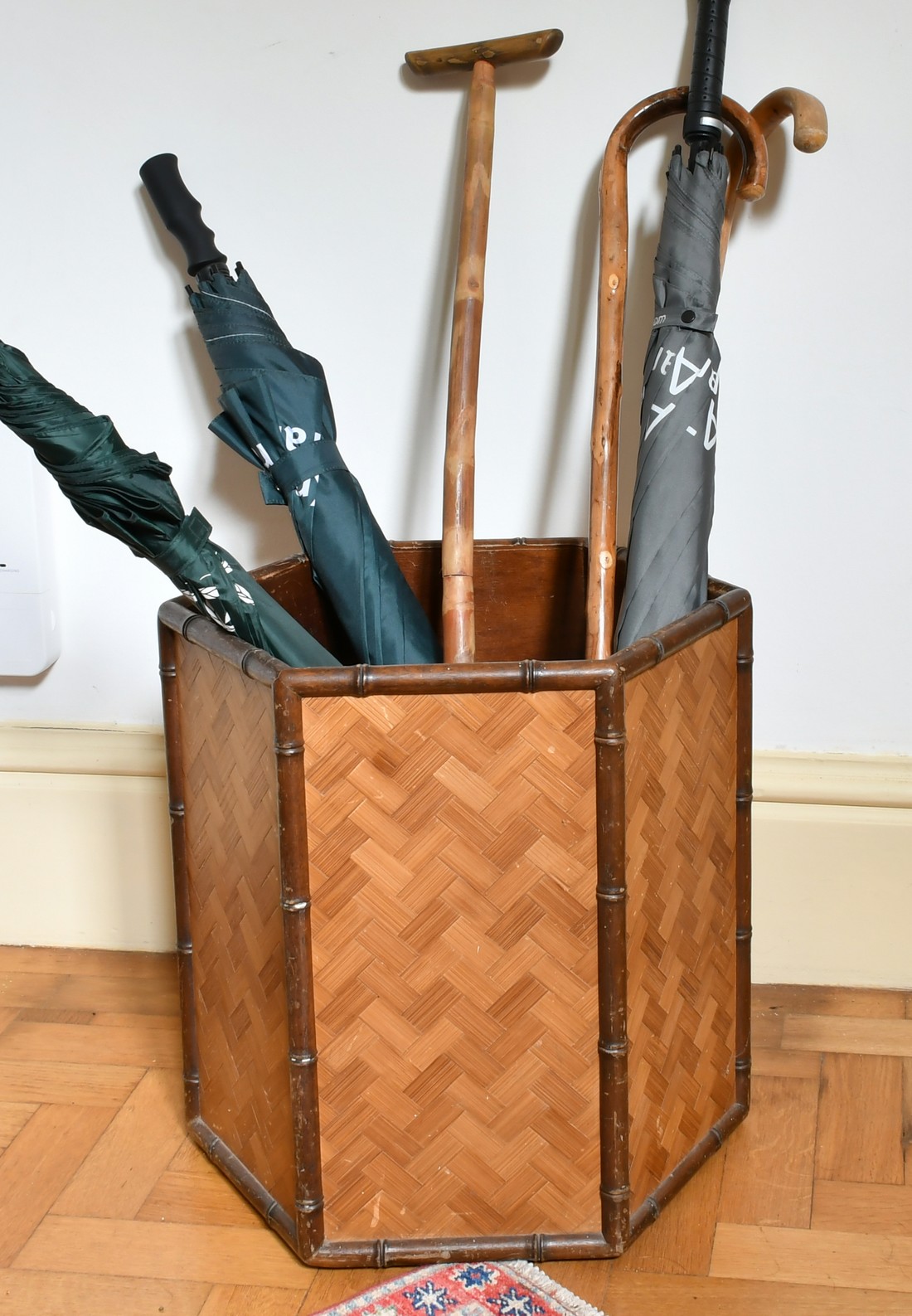 A WICKER STICK STAND .