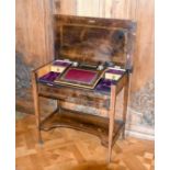 A VICTORIAN ROSEWOOD INLAID SIDE TABLE, the flap opens to reveal a desk, on tapering legs with