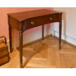 A LATE REGENCY GILLOW MAHOGANY PLAIN CONCAVE FRONTED SIDE TABLE with long frieze drawer, on turned