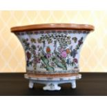 A CHINESE PORCELAIN OVAL FLORAL JARDINIERE AND STAND.