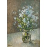 Brian Nolan 20th century British school, A still life of blue flowers in a glass vase, oil on board,