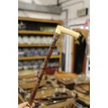 A ivory handle bamboo walking stick