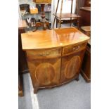 An inlaid mahogany bow front tv cabinet