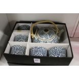 A Japanese porcelain saki set, boxed