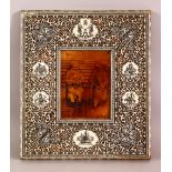 A 19TH CENTURY INDIAN CARVED AND PIERCED IVORY AND SANDALWOOD FRAME, with pen work decoration,