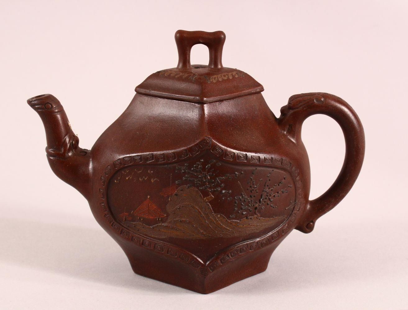 A CHINESE YIXING DIAMOND SHAPE TEAPOT, with a panel depicting a stylised landscape and another panel
