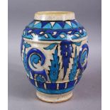 A GOOD PERSIAN BLUE & WHITE POTTERY VASE, decorated with moulded formal floral design, 23cm high.
