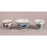 A SMALL GROUP OF MING STYLE DOUCAI CUPS, comprising one tea cup and two smaller ones, larger 9cm
