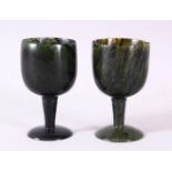 A GOOD PAIR OF MUGHAL CARVED SPINACH GREEN JADE GOBLETS, 10cm high X 5.6cm diameter