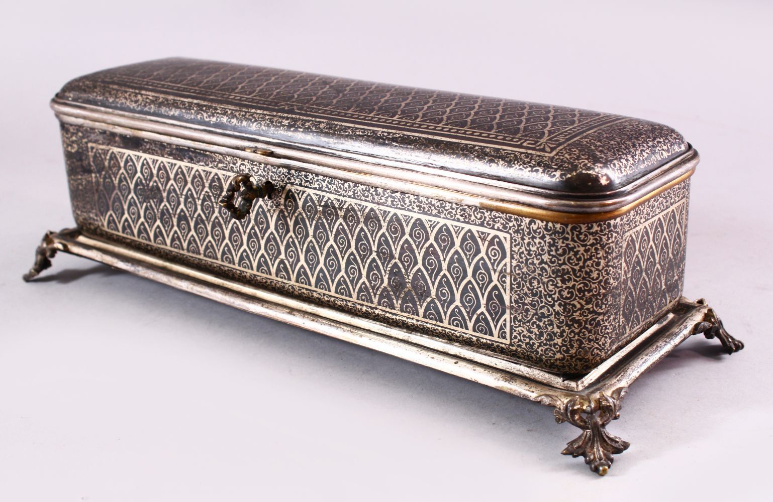 A BIDRI STYLE RECTANGULAR HINGED CASKET for the European market, with panels of scrolling