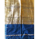 A GILT DECORATED BLUE COTTON INDIAN TISSUE, Circa 1920, 11ft 8in x 1ft 8in.