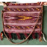 A TEKKE EMBROIDERY MADE INTO A SHOULDER BAG, together with three further shoulder bags made from