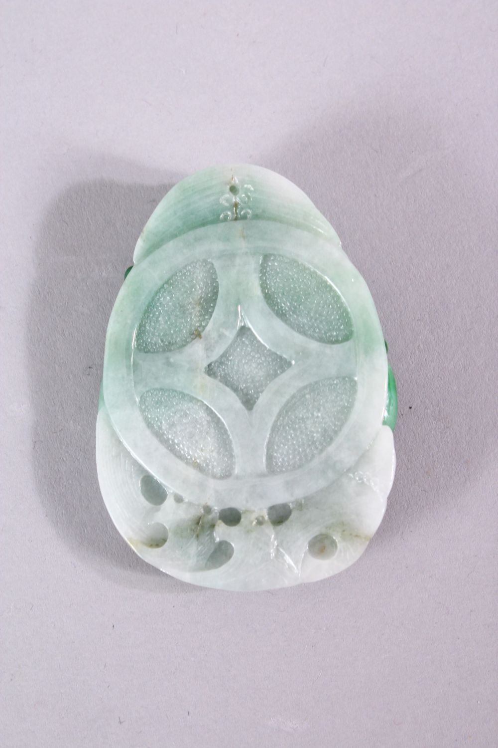 A CHINESE CARVED JADEITE PENDANT, 6cm x 4cm. - Image 2 of 2