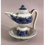 A CHINESE BLUE AND WHITE TEAPOT, painted with bands of foliate decoration, the base with built in