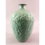 A CHINESE CELADON MOULDED LANTERN SHAPED PORCELAIN VASE - with moulded decoration of immortal