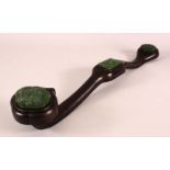 A CHINESE CARVED JADE & HARDWOOD RUYI SCEPTER - the carved wooden item with three inset carved