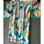 A GOLD VEINED SILK KIMONO with large abstract floral decoration, approx. 4ft 2in.