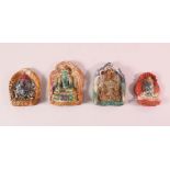 FOUR TIBETAN POTTERY MOULDED PANELS, each depicting a beast or buddha figure, 11cm down to 8cm (4)