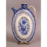 A BLUE & WHITE IZNIK POTTERY WATER URN - decorated with floral decoration - 26.5cm ( handle af)