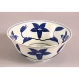 A CHINESE CHENHUA STYLE BLUE AND WHITE PORCELAIN BOWL, painted with flowers, 15.5cm diameter.