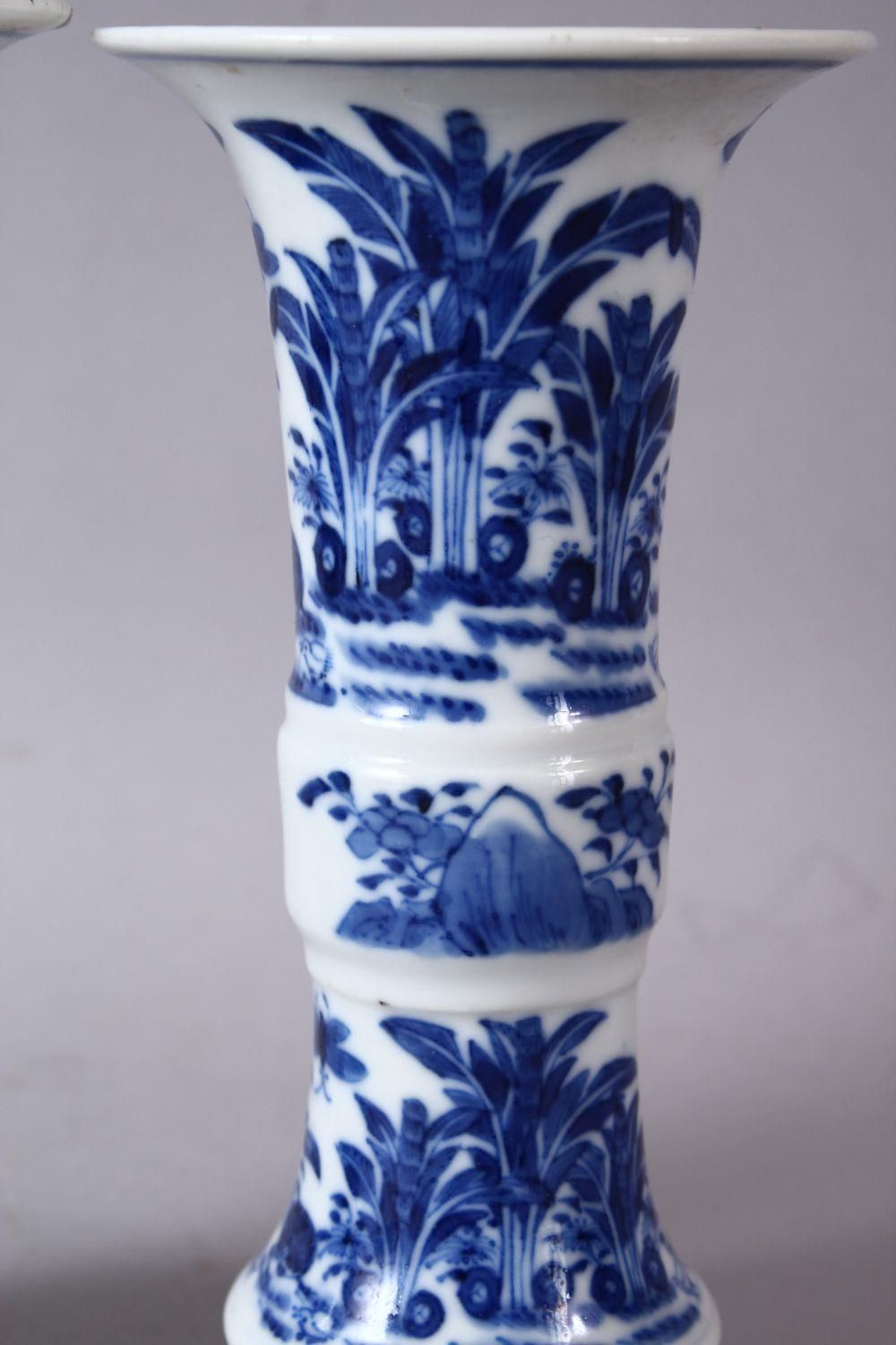 A PAIR OF 19TH CENTURY OR LATER CHINESE BLUE & WHITE PORCELAIN GU VASES, The body of the vases - Image 3 of 6