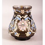 AN ISLAMIC AMBER GLASS VASE with enamel decoration, 12cm high.